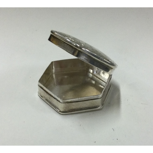 284 - A small silver pill box with engraved decoration. Approx. 15 grams. Est. £20 - £30.