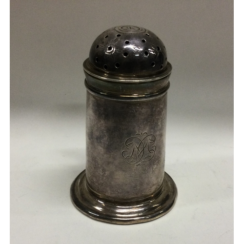 295 - NEWCASTLE: An early 18th Century rare silver kitchen pepper with handle. Approx. 90 grams. Est. £400... 