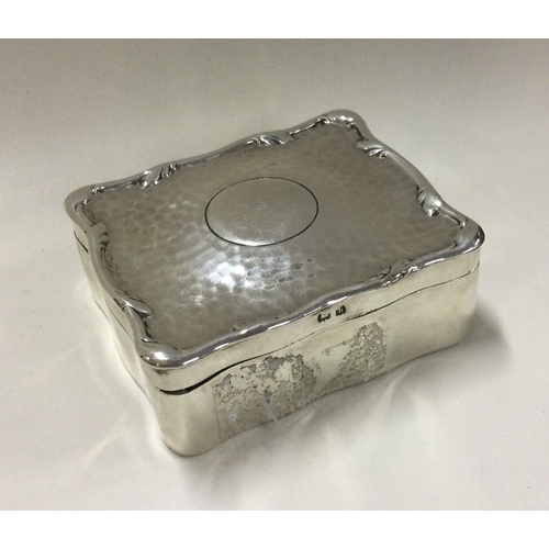 31 - An unusual silver jewellery box with hammered textured body. Birmingham 1907. By HM. Approx. 122 gra... 