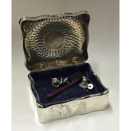 31 - An unusual silver jewellery box with hammered textured body. Birmingham 1907. By HM. Approx. 122 gra... 