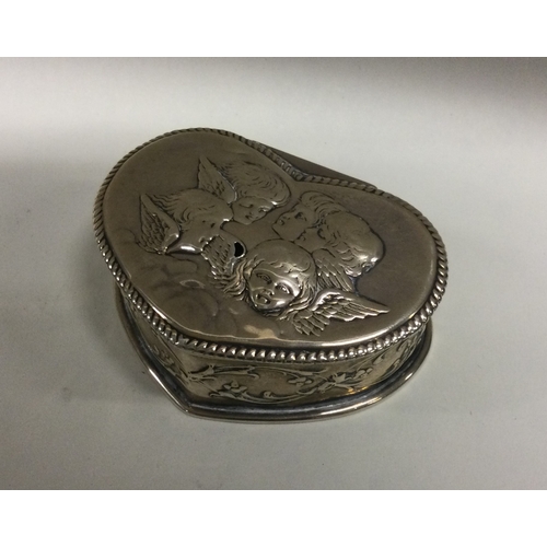 45 - A heart shaped silver dressing table box decorated with winged infants. Approx. 75 grams. Est. £30 -... 