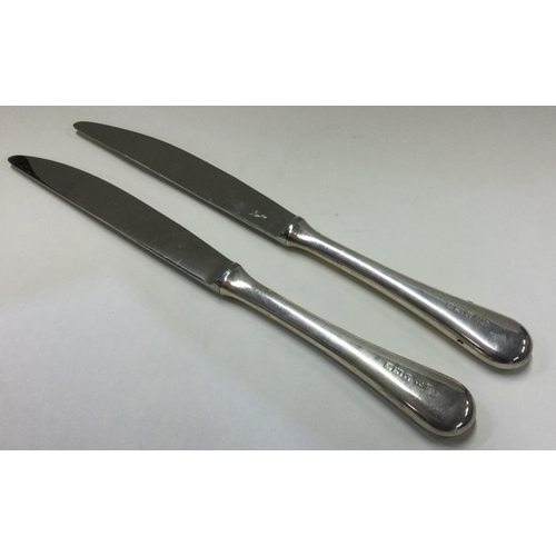 47 - A good pair of silver table knives. Birmingham. By Robert Welch. Approx. 96 grams. Est. £50 - £80.