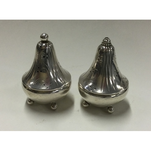 48 - GEORG JENSEN: A good pair of salt and pepper pots. Marked to bases. Approx. 51 grams. Est. £250 - £3... 