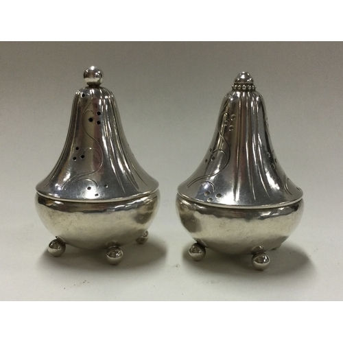 48 - GEORG JENSEN: A good pair of salt and pepper pots. Marked to bases. Approx. 51 grams. Est. £250 - £3... 