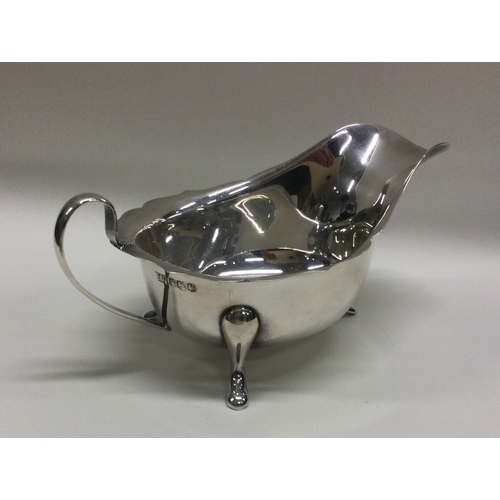 5 - A heavy silver sauce boat with card cut rim. Sheffield. Approx. 106 grams. Est. £30 - £50