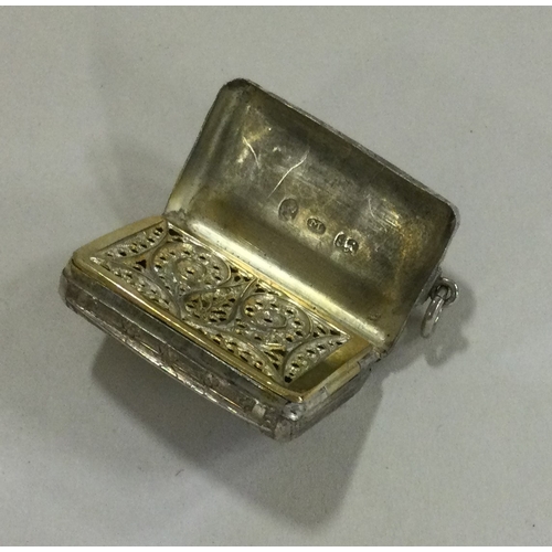 50 - An unusual silver vinaigrette in the form of a purse. Birmingham 1815. Approx. 13 grams. Est. £150 -... 