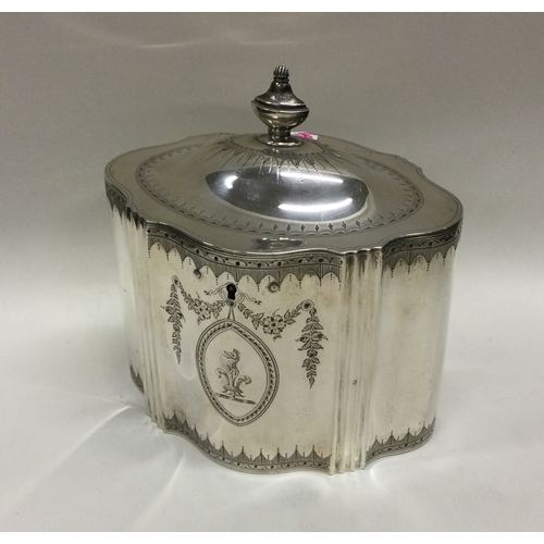 53 - A Georgian silver tea caddy with engraved bright cut decoration. London 1788. By William Plummer. Ap... 