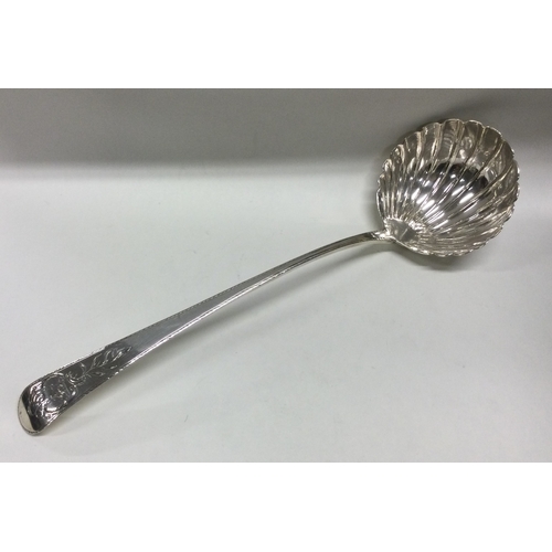 58 - DUBLIN: An Irish silver soup ladle. 1724. Marked only with crowned Hibernia and Gothic letter 'E'. A... 