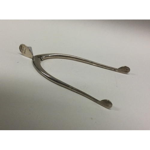 6 - A pair of silver wishbone sugar tongs. Birmingham. Approx. 11 grams. Est. £10 - £20.