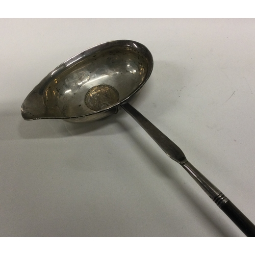 60 - A Georgian silver toddy ladle with whalebone handle. Approx. 47 grams. Est. £20 - £30.