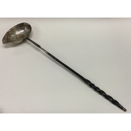 60 - A Georgian silver toddy ladle with whalebone handle. Approx. 47 grams. Est. £20 - £30.