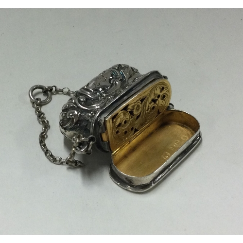 68 - An unusual silver vinaigrette in the form of a handbag. Birmingham 1856. By JT. Approx. 15 grams. Es... 