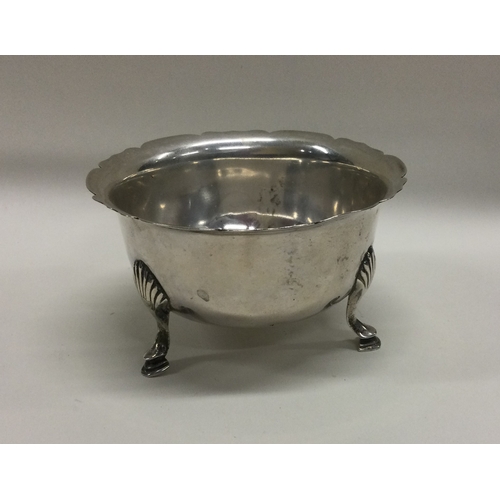 7 - A heavy silver sugar bowl with card cut rim. London. Approx. 90 grams. Est. £30 - £40.