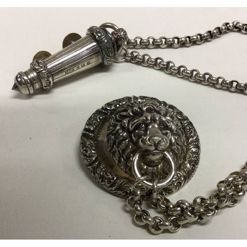 90 - A silver Policeman's whistle on chain with lion mask pin. Birmingham 1907. By J&Co. Approx. 125 gram... 