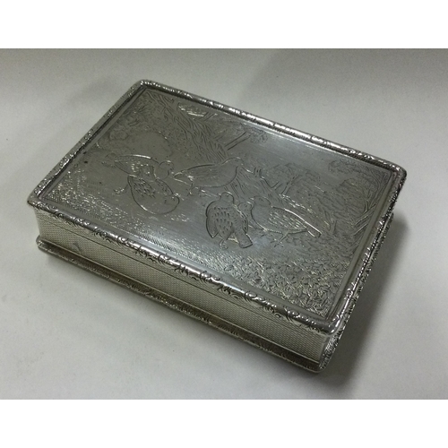 95 - A heavy silver snuff box decorated with birds. Approx. 175 grams. Est. £400 - £500.