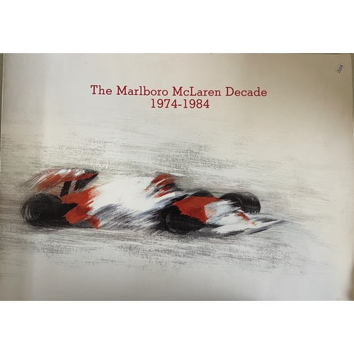 203A - BOOKS: The Marlboro McLaren Decade 1974-1984. A portfolio of 10 various Formula 1 racing cars with a... 