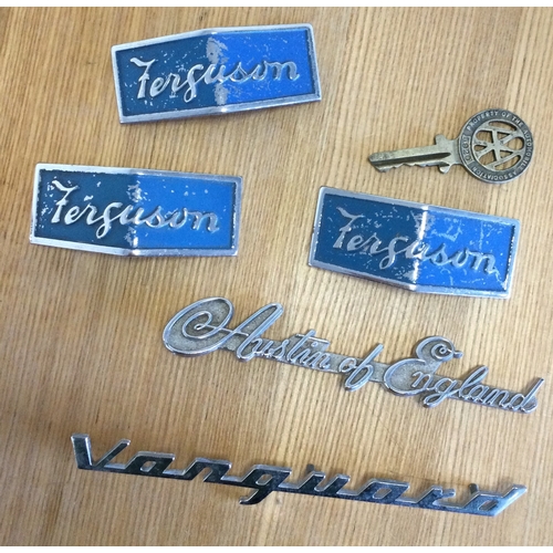 339 - A Vanguard car badge together with other car badges. Est. £50 - £80.