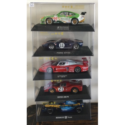 353 - SCALEXTRIC: Five various boxed model racing cars. Est. £20 - £30.