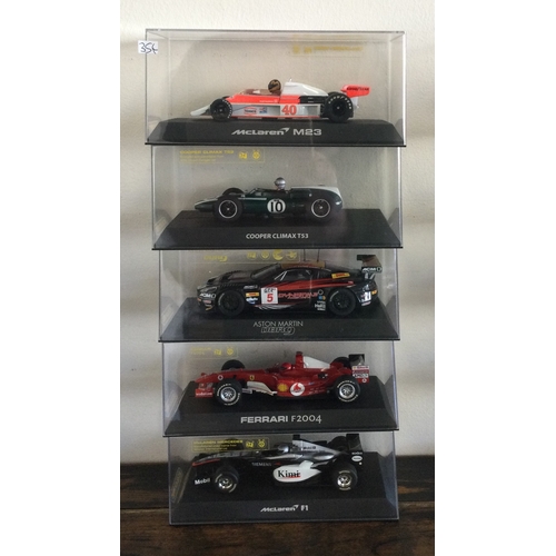 354 - SCALEXTRIC: Five various boxed model racing cars. Est. £20 - £30.