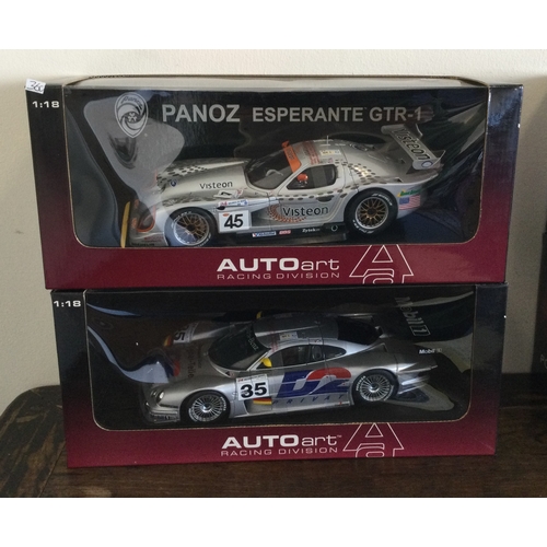 360 - AUTOart Racing Division: Two various boxed model racing cars, scale 1:18. Est. £20 - £30.