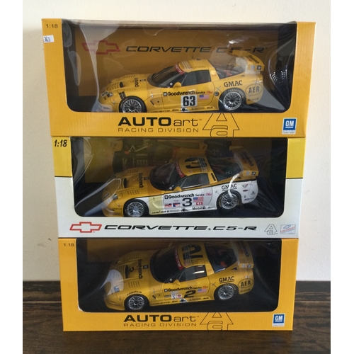 363 - AUTOart Racing Division: Three various boxed model racing cars, scale 1:18. Est. £20 - £30.