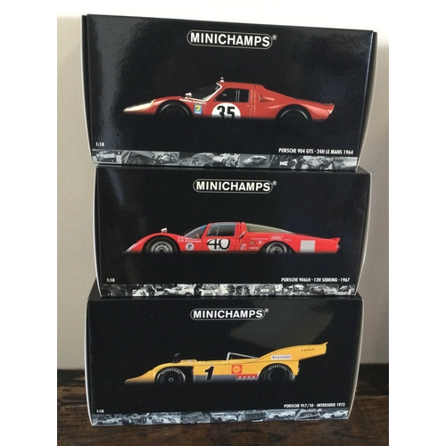 376 - MINICHAMPS: Three various boxed model racing cars, scale 1:18. Est. £20 - £30.