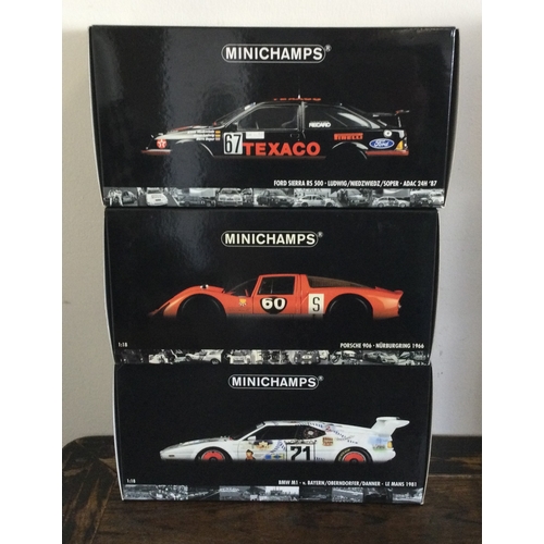 378 - MINICHAMPS: Three various boxed model racing cars, scale 1:18. Est. £20 - £30.