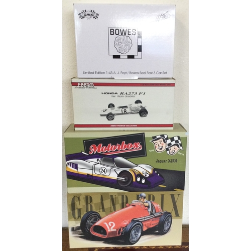 586 - Four various boxed model racing cars. Est. £30 - £50.