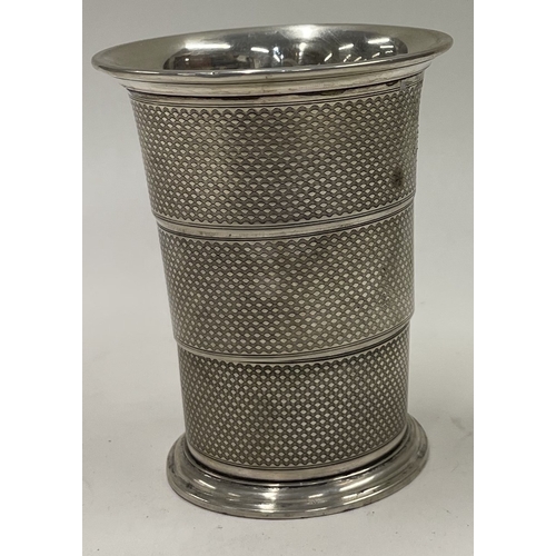 103 - An engine turned collapsible silver beaker. Maker's mark only to base. Approx. 79 grams. Est. £150 -... 