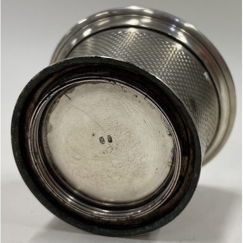 103 - An engine turned collapsible silver beaker. Maker's mark only to base. Approx. 79 grams. Est. £150 -... 