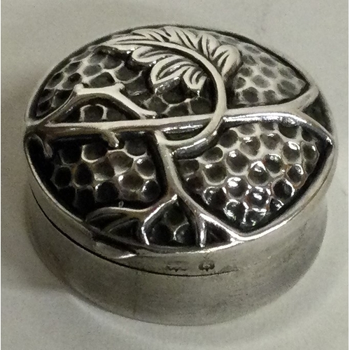 107 - An unusual chased silver hinged box. Birmingham 1910. Approx. 5 grams. Est. £20 - £30.