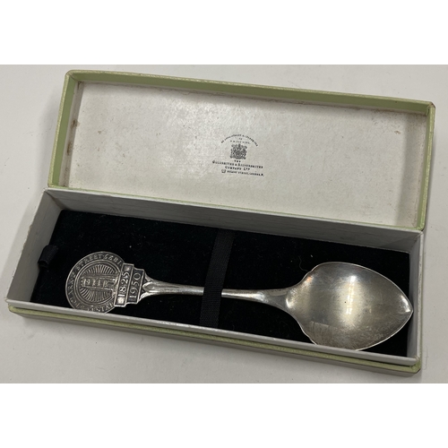 12 - A heavy cased commemorative silver spoon embossed with a castle. London 1950. By Goldsmiths & Silver... 