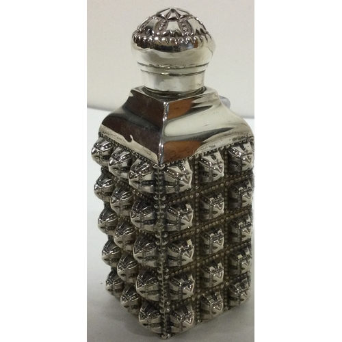 127 - A rare novelty Victorian deeply embossed silver scent bottle. London 1880. By CSFS. Approx. 48 grams... 