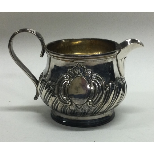 135 - A Victorian silver half fluted cream jug . London. Approx. 56 grams.  Est. £30 - £40.