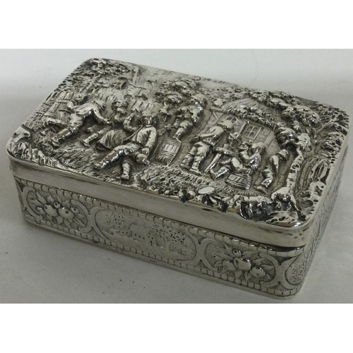 137 - A finely chased Victorian silver snuff box embossed with musicians. bearing import marks. Sheffield ... 