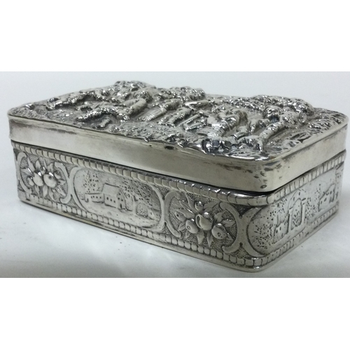 137 - A finely chased Victorian silver snuff box embossed with musicians. bearing import marks. Sheffield ... 