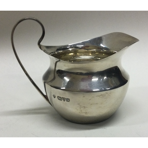 152 - A small silver cream jug of plain form. Approx. 45 grams.  Est. £20 - £30.