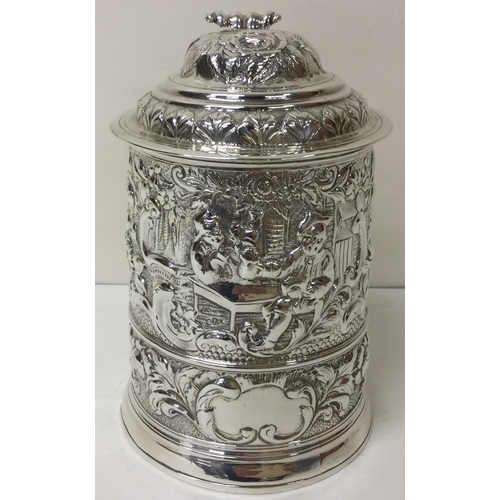 163 - A fine George I chased silver tankard embossed with tavern scene. London 1724.  Approx. 642 grams. E... 