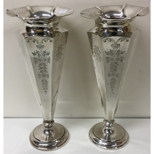 187 - A large pair decorative silver vases. Sheffield 1910. By Fenton Brothers Ltd. Approx. 644 grams. Est... 