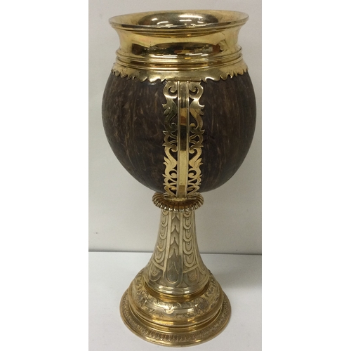 190 - A very rare oversized silver gilt coconut presentation cup. London 1928. By Cohen and Charles. Appro... 