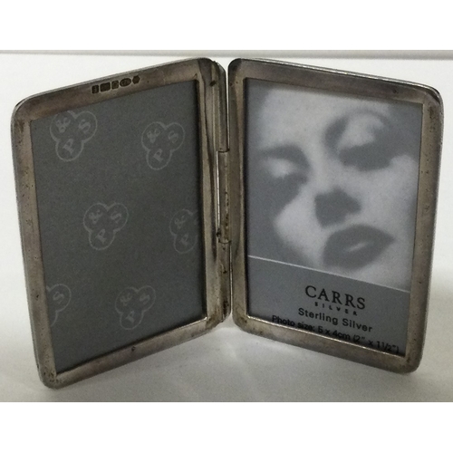 194 - CARRS: A silver double photo frame. London 2004. Approx. 35 grams. Est. £30 - £50.