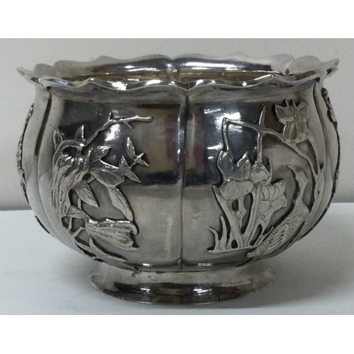 196 - A novelty 19th Century Chinese silver bowl embossed with birds. By Hung Chong and Co. Approx. 160 gr... 