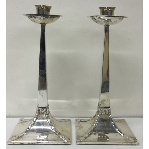 197 - A pair of Art Deco Victorian silver candlesticks with beaded design. Sheffield 1896. By James Dixon ... 