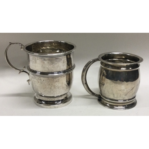 201 - An Edwardian silver christening mug together with one other. Approx. 79 grams. Est. £30 - £40.