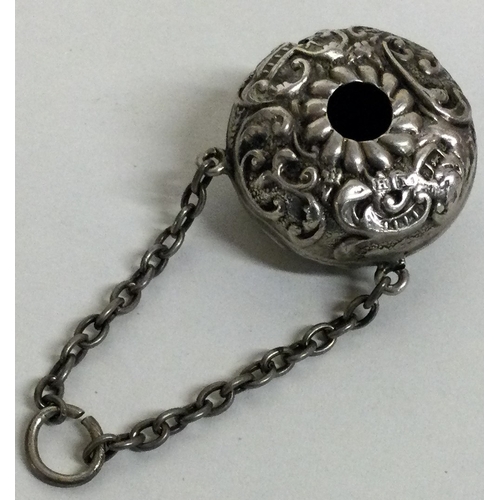 208 - A novelty silver chased babies rattle with suspended chain. Birmingham 1900.  Approx. 7  grams. Est.... 