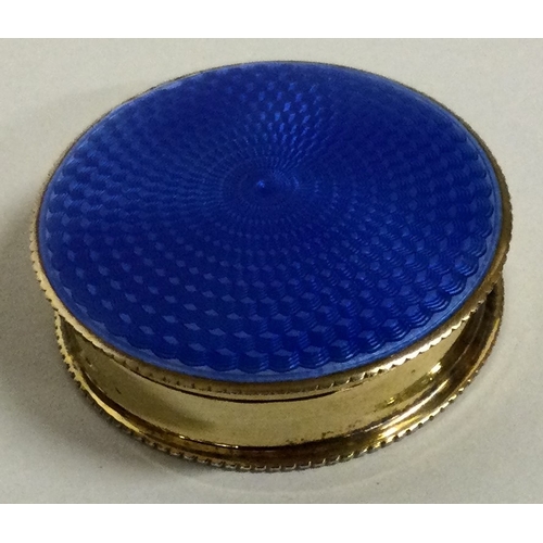 209 - A silver gilt and blue enamelled silver box. Birmingham 1926.  Approx. 26 grams. Est. £100 - £150.