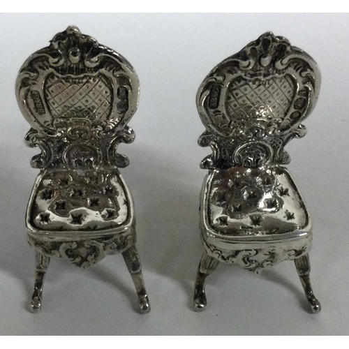 212 - A novelty pair silver chairs. Import marked. Approx. 28 grams. Est. £60 - £80.