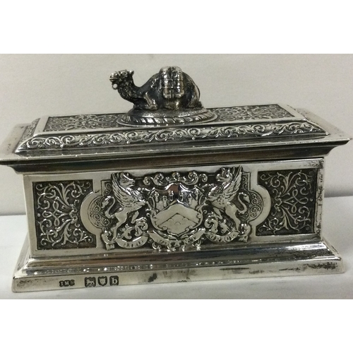 213 - A rare Victorian silver chased silver box with coat of arms to both sides. London 1897. By Spink and... 