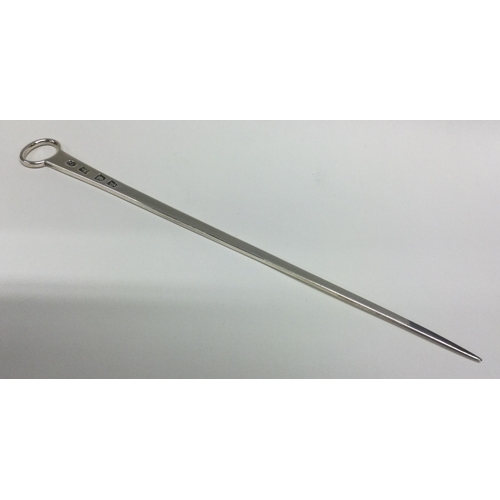 230 - A heavy tapering silver meat skewer. London. By TJ. Approx. 63 grams. Est. £60 - £80.