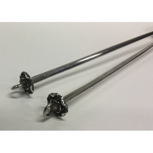 231 - A pair of meat skewers with chased decoration. Approx. 36 grams. Est. £40 - £60.